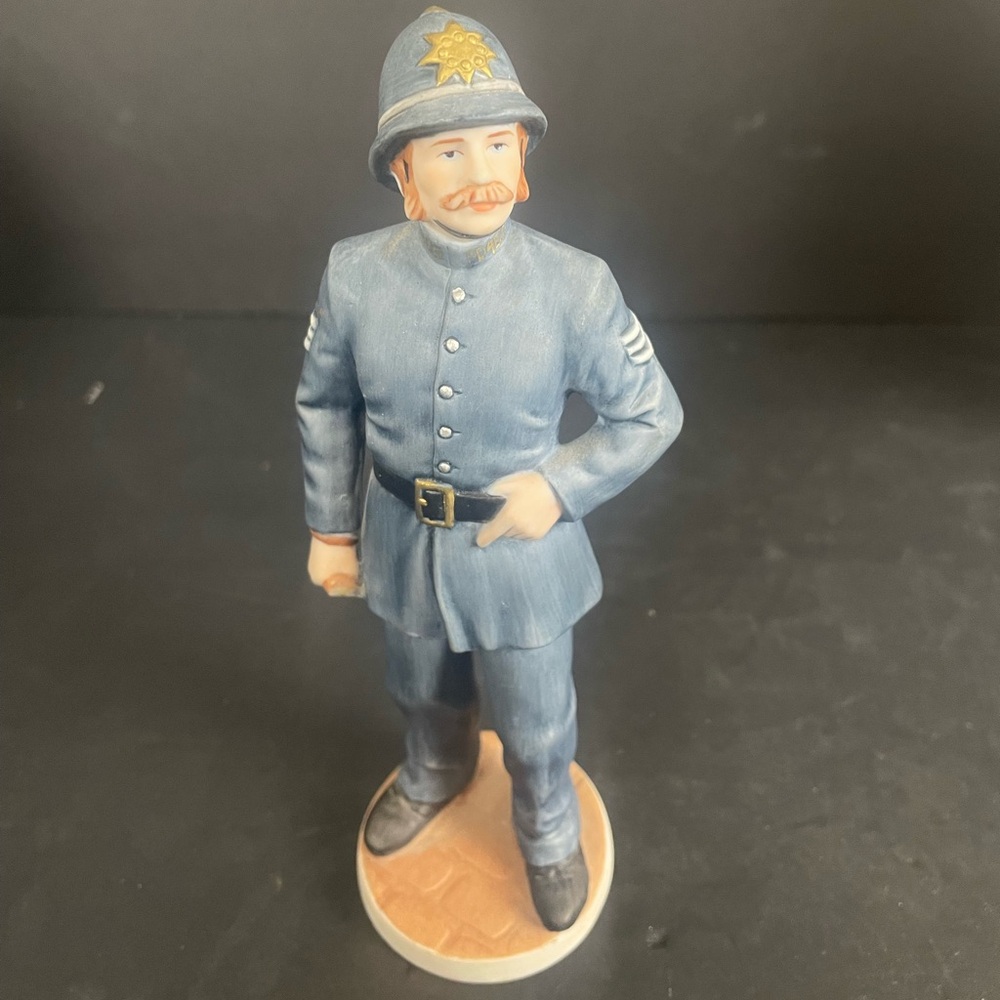 Ceramic Police Officer Figurine in Blue Uniform